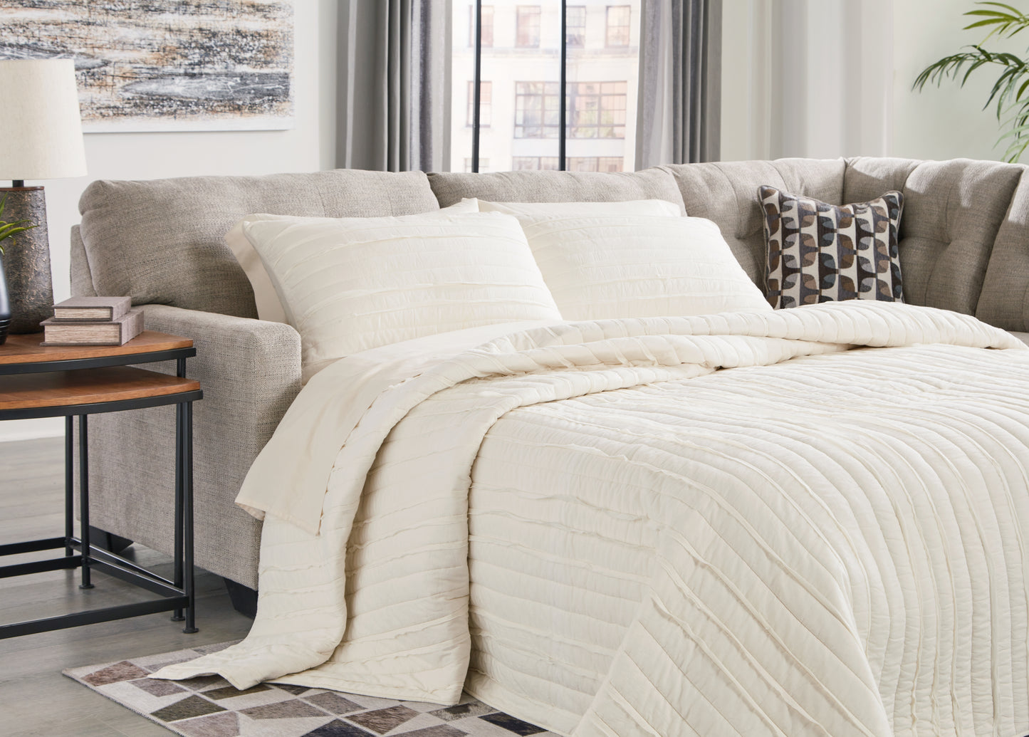 Haines Furniture Outlet - Ashley Furniture - Mahoney Sectional - 2-Piece Sleeper Sectional with Chaise / Pebble - 31004S4