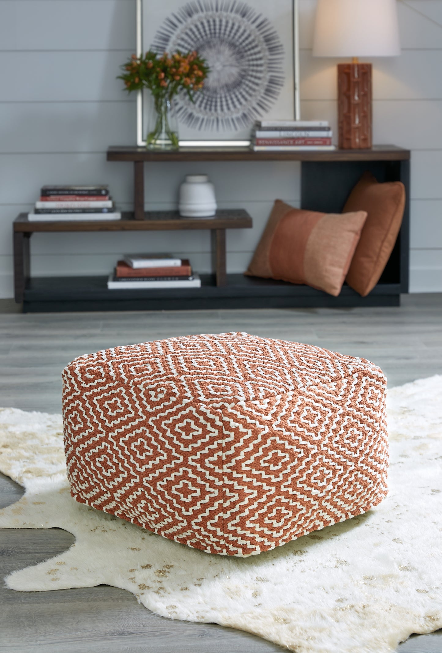 Haines Furniture Outlet - Ashley Furniture - Brynnsen Pouf - Pouf / Rust/Ivory - A1001056