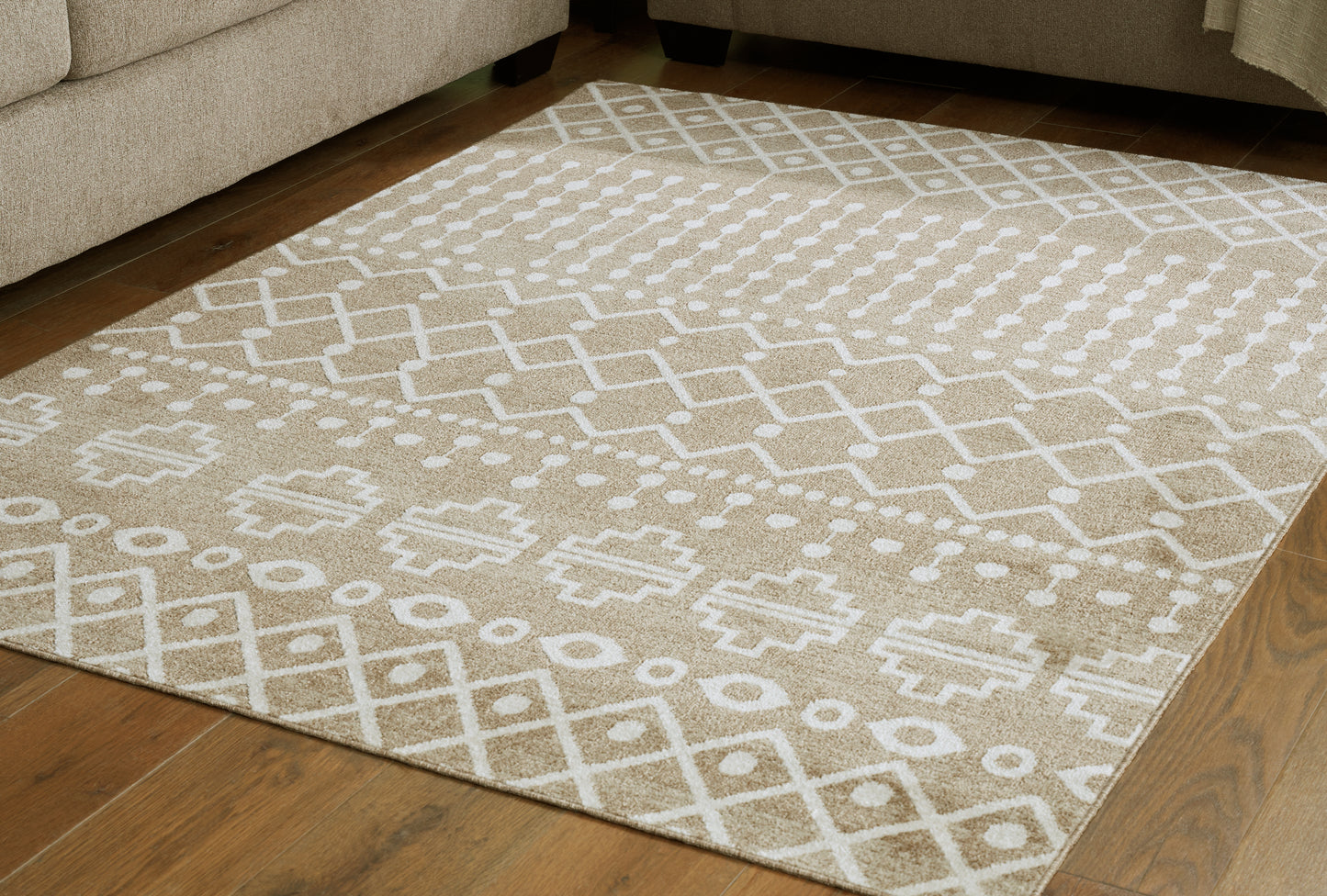 Haines Furniture Outlet - Ashley Furniture - Bunchly Rug - 4'11" x 7'2" Washable Rug / Tan/Brown/Cream - R406222