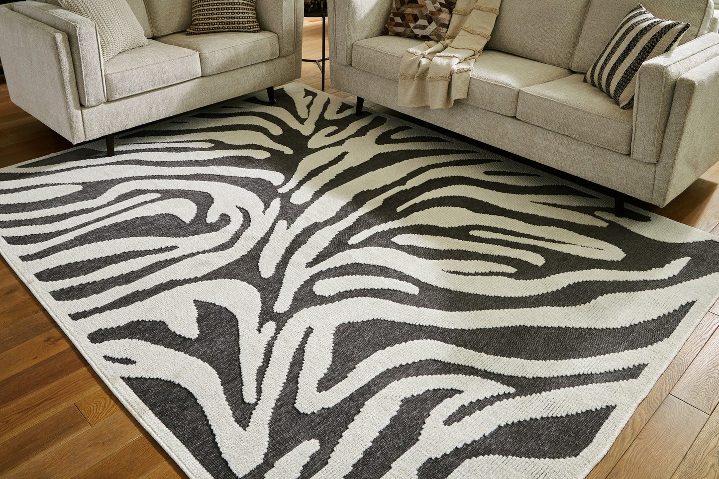 Haines Furniture Outlet - Ashley Furniture - Thomwith Rug - 8' x 10'2" Washable Rug / Black/Ivory - R406291