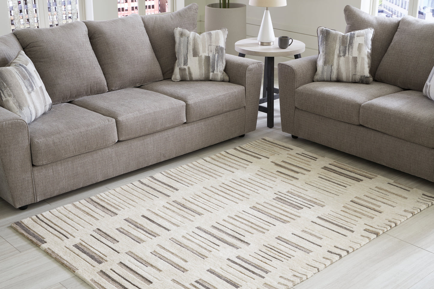 Haines Furniture Outlet - Ashley Furniture - Leesdale Rug - 5' x 7' Rug / Ivory/Brown/Black - R406422