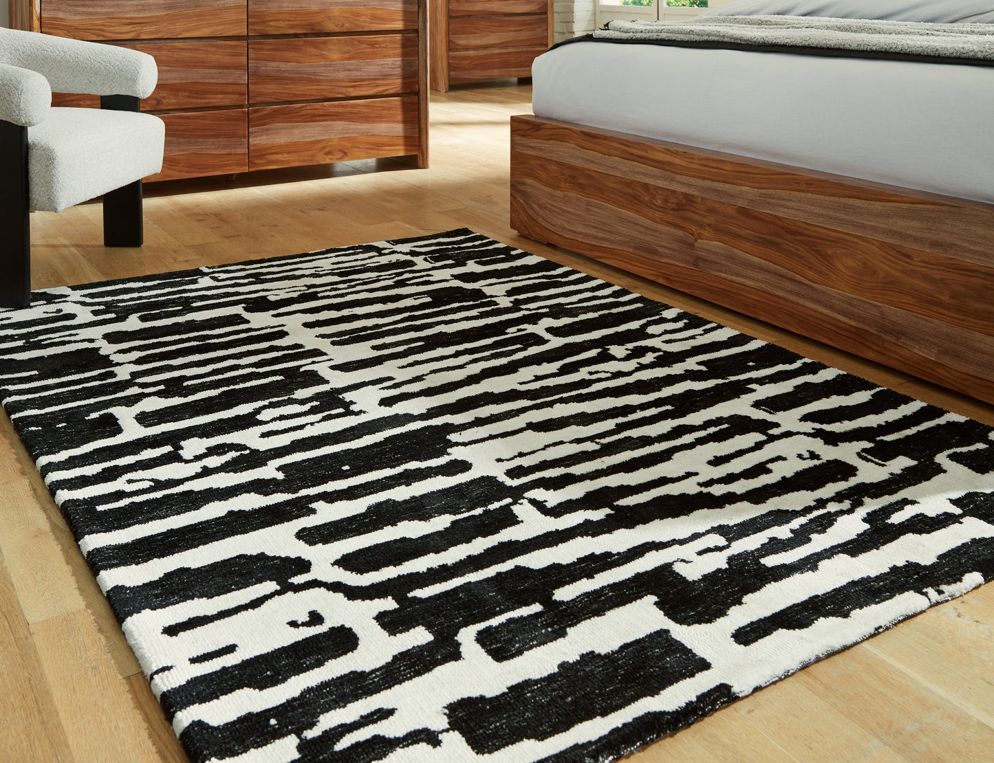 Haines Furniture Outlet - Ashley Furniture - Bramshaw Rug - 5' x 7' Rug / Black/Ivory - R406762