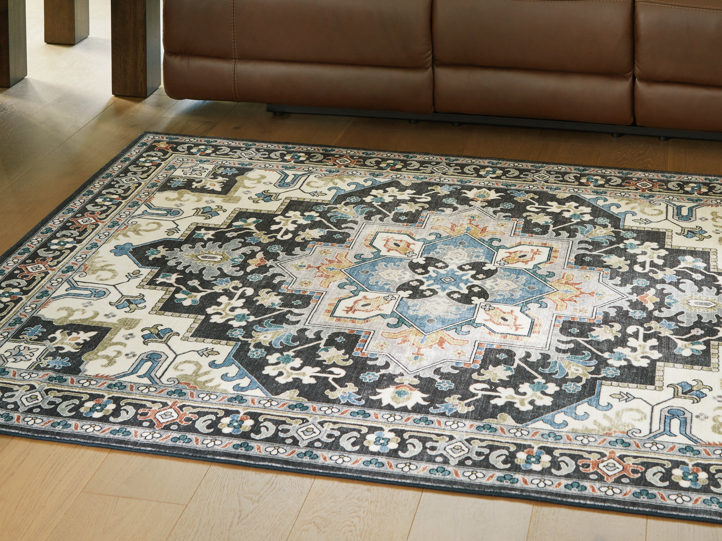 Haines Furniture Outlet - Ashley Furniture - Leningston Rug - 5' x 7' Washable Rug / Black/Cream/Blue - R407062