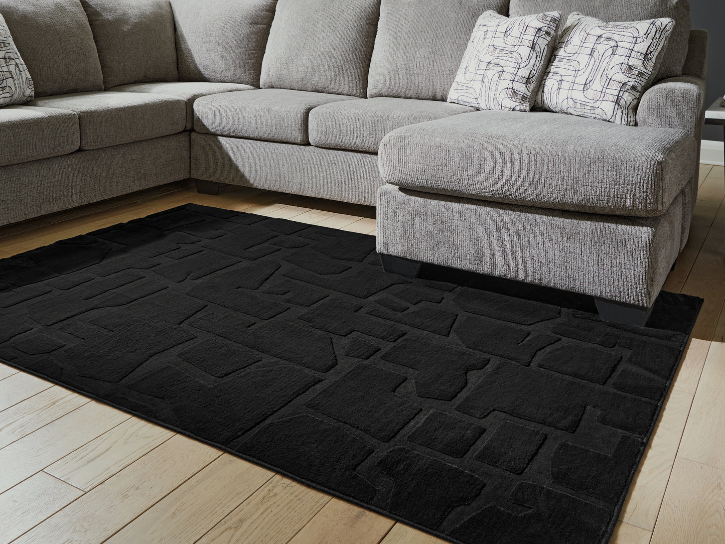 Haines Furniture Outlet - Ashley Furniture - Gibbswell Rug - Washable 5' x 7' Area Rug / Black - R407462