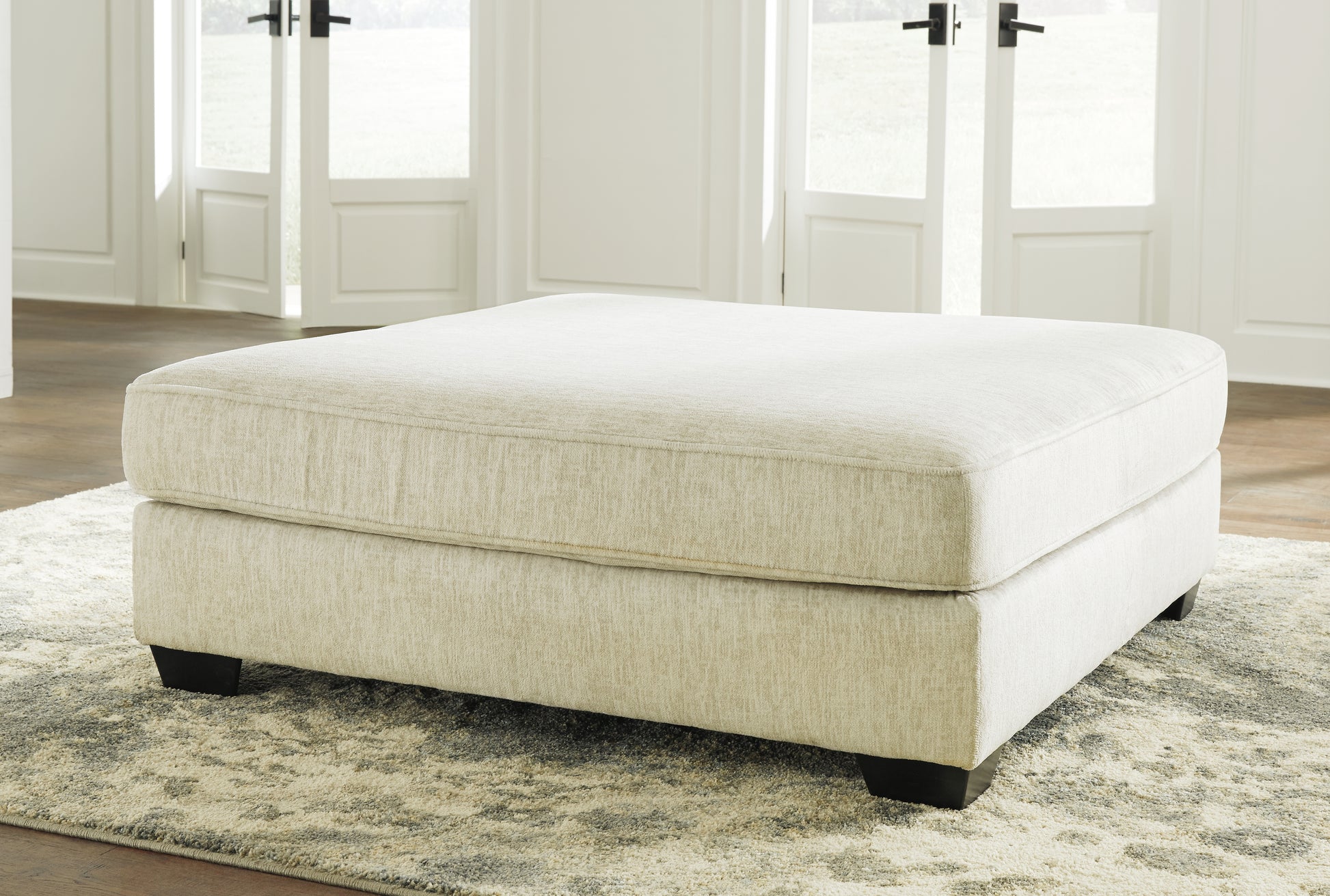 Haines Furniture Outlet - Ashley Furniture - Rawcliffe Living Room - Oversized Accent Ottoman / Parchment - 1960408