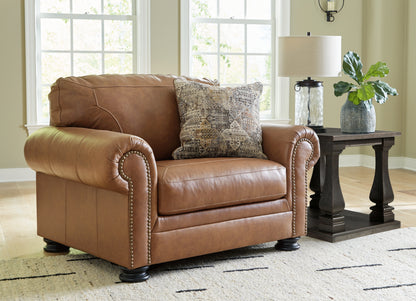 Haines Furniture Outlet - Ashley Furniture - Carianna Living Room - Chair and a Half / Caramel - 5760423