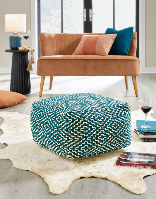 Haines Furniture Outlet - Ashley Furniture - Brynnsen Pouf - Pouf / Rust/Ivory - A1001056