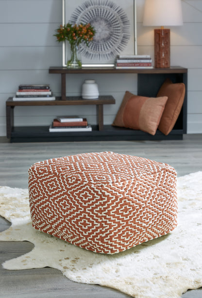 Haines Furniture Outlet - Ashley Furniture - Brynnsen Pouf - Pouf / Rust/Ivory - A1001056