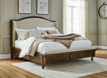 Haines Furniture Outlet - Ashley Furniture - Sturlayne Bedroom - King Upholstered Panel Bed / Brown - B787B4