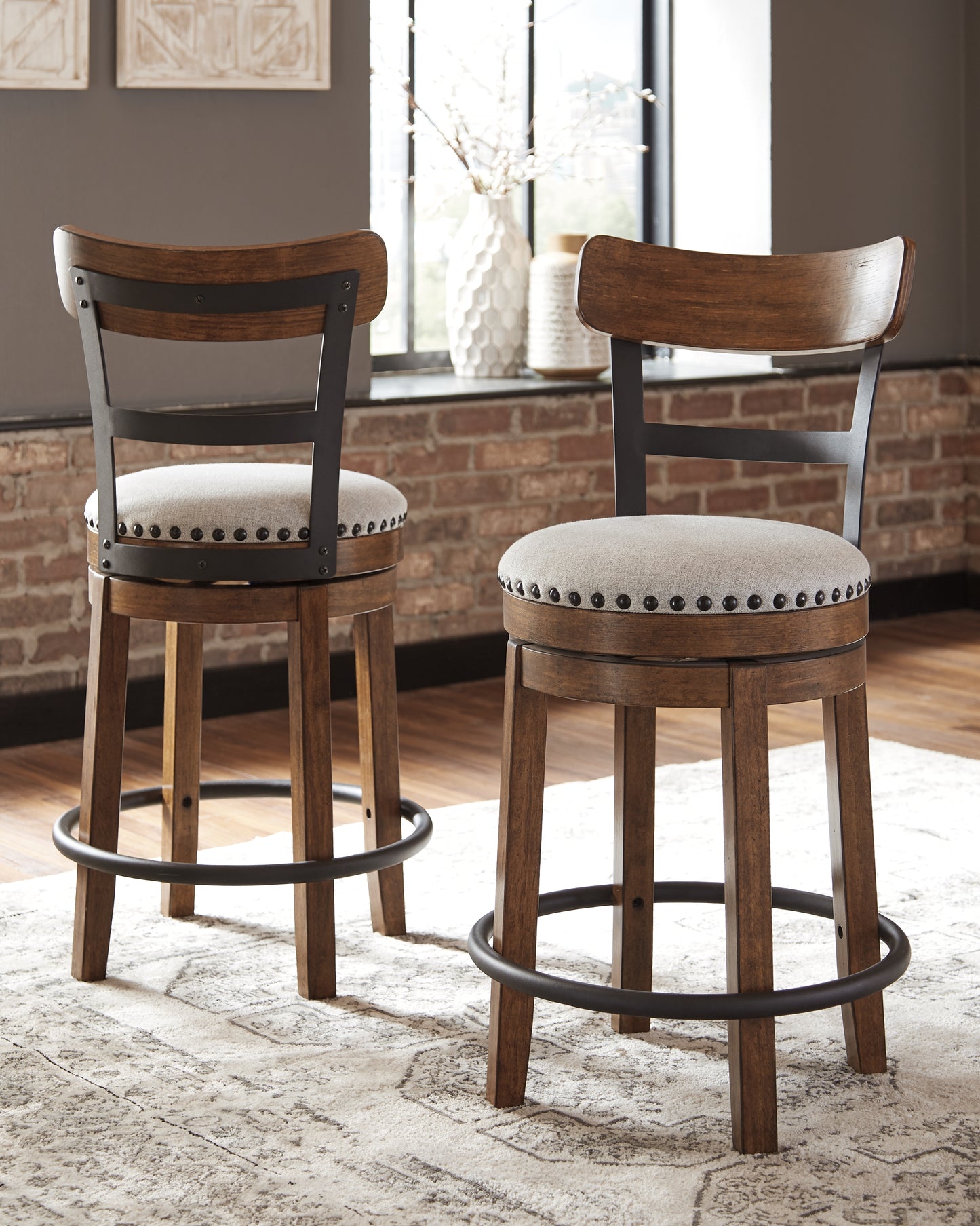 Haines Furniture Outlet - Ashley Furniture - Valebeck Dining Room - UPH Swivel Barstool (1/CN) / Brown - D546-424