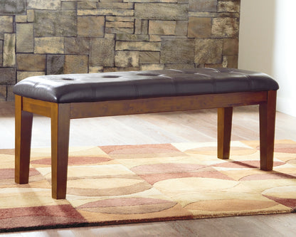 Haines Furniture Outlet - Ashley Furniture - Ralene Dining Bench - Large UPH Dining Room Bench / Medium Brown / 50"W x 16"D x 19"H - D594-00