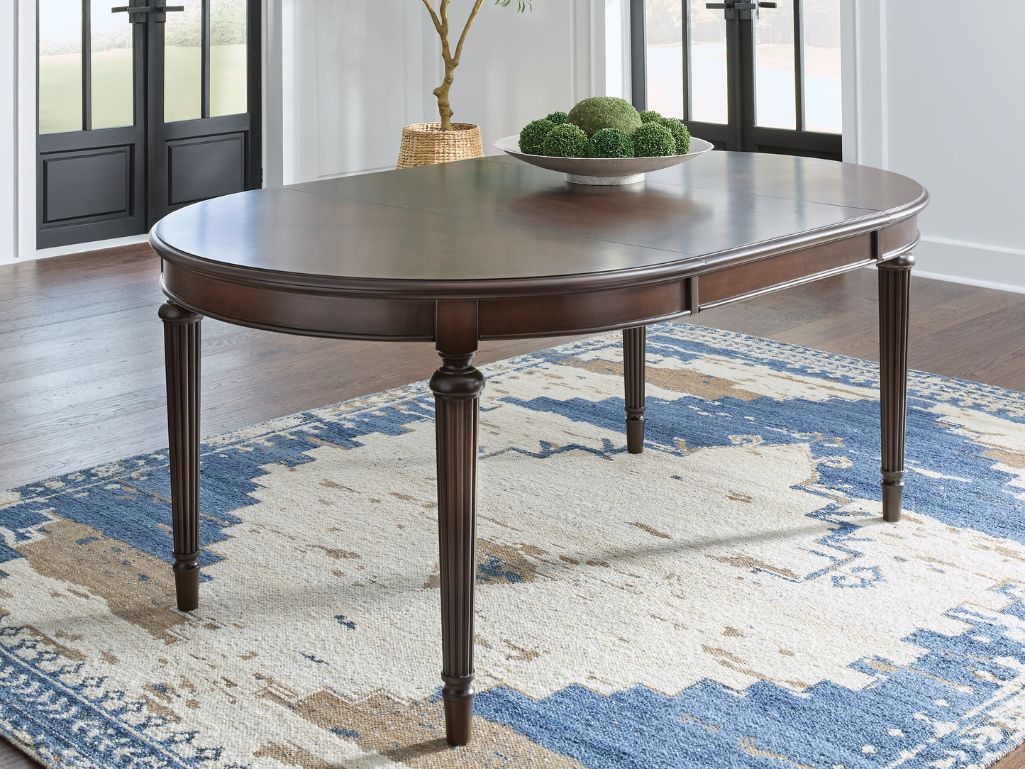 Haines Furniture Outlet - Ashley Furniture - Lavinton Dining Room - Oval Dining Room EXT Table / Brown - D764-35