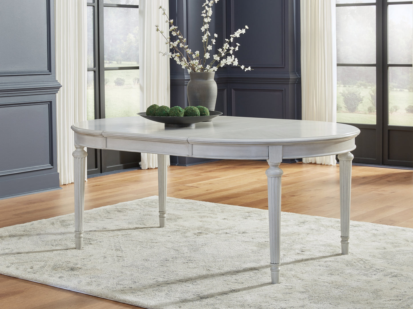 Haines Furniture Outlet - Ashley Furniture - Montelaine Dining Room - Oval Dining Room EXT Table / Antique White - D795-35