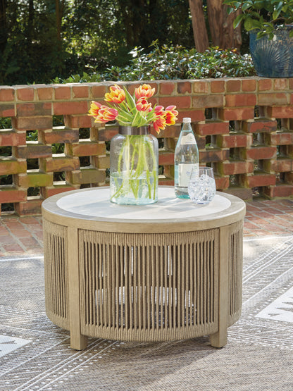 Haines Furniture Outlet - Ashley Furniture - Spooners Cove Outdoor - Round Cocktail Table / Beige - PCP469-708