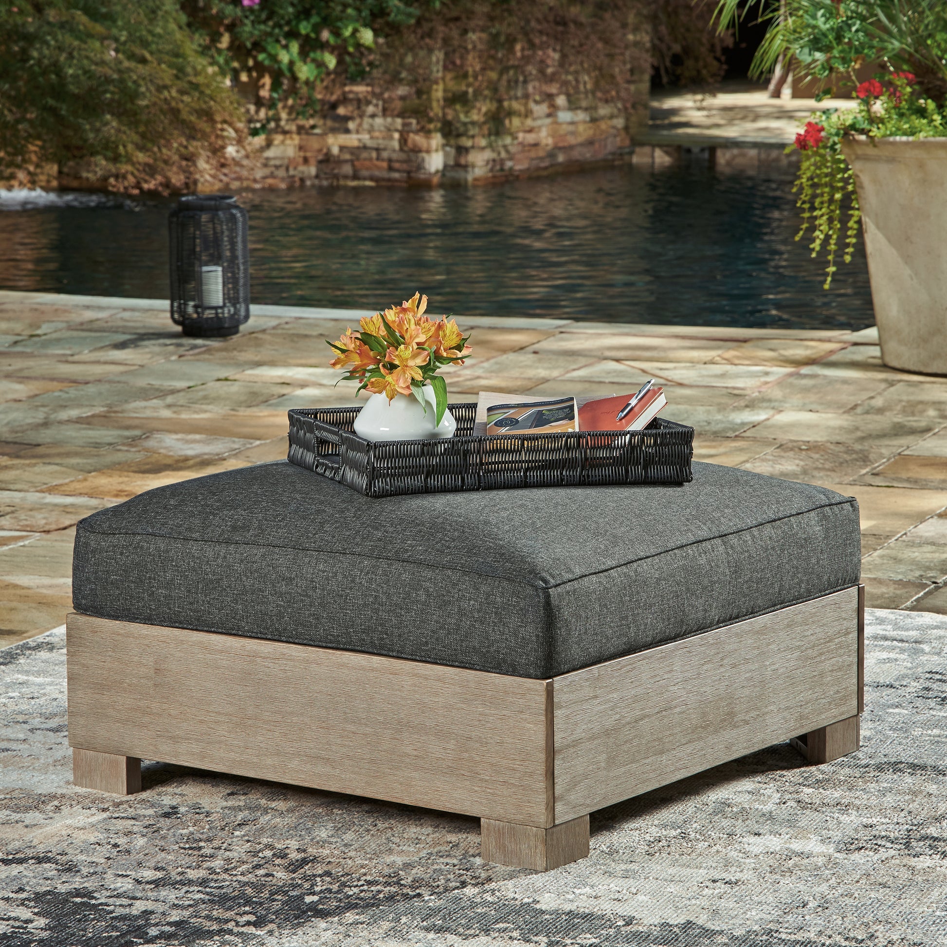 Haines Furniture Outlet - Ashley Furniture - Citrine Park Outdoor - Ottoman with Cushion / Brown/Charcoal - P660-814