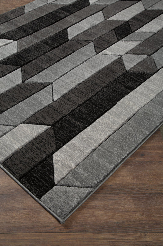 Haines Furniture Outlet - Ashley Furniture - Chayse Rug - 5' x 6'7" Rug / Black/Gray - R403462