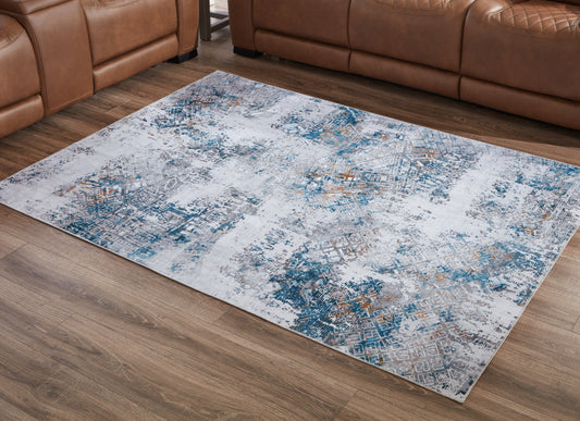 Haines Furniture Outlet - Ashley Furniture - Garyard Rug - 5' x 7' Washable Rug / Multi - R405772