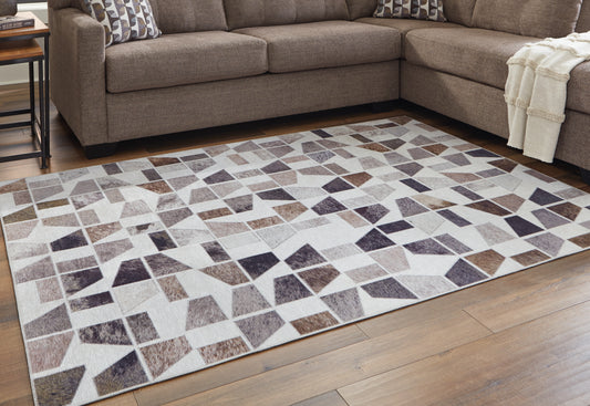 Haines Furniture Outlet - Ashley Furniture - Jettner Rug - 7'10" x 10' Rug / Multi - R405781