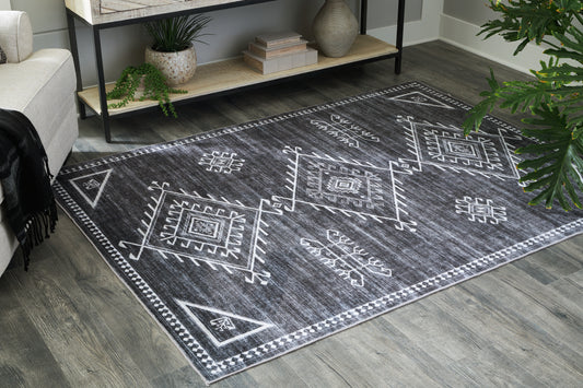 Haines Furniture Outlet - Ashley Furniture - Arloman Rug - 5' x 7' Washable Rug / Black/Cream/Gray - R405932