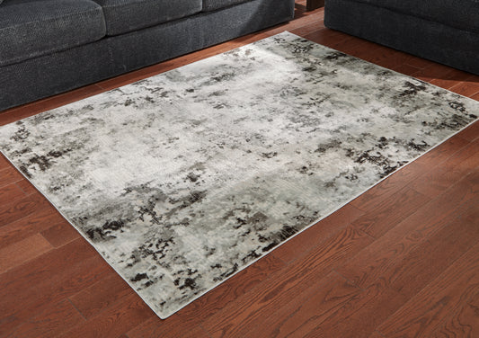 Haines Furniture Outlet - Ashley Furniture - Greyland Rug - 5' x 7' Rug / Multi - R405972