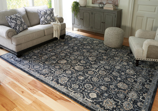 Haines Furniture Outlet - Ashley Furniture - Hilcott Rug - 5'3" x 7'3" Rug / Blue/Cream/Brown - R406112