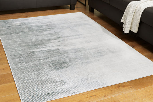 Haines Furniture Outlet - Ashley Furniture - Milset Rug - 5'1" x 6'10" Washable Rug / Black/White/Gray - R406252