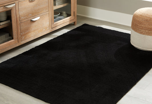 Haines Furniture Outlet - Ashley Furniture - Anaben Rug - 5' x 7' Washable Rug / Black - R406312