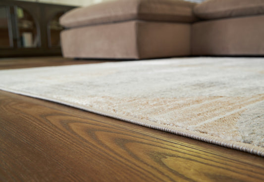 Haines Furniture Outlet - Ashley Furniture - Truward Rug - 5' x 7' Rug / Linen/Gray/Caramel - R406472
