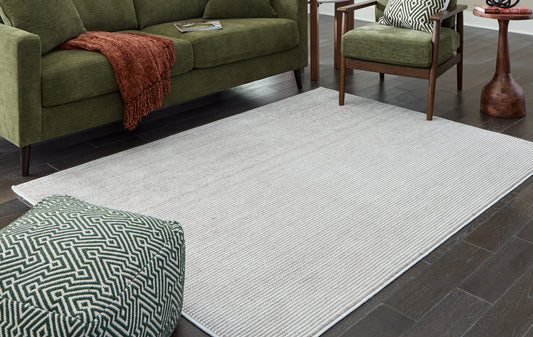 Haines Furniture Outlet - Ashley Furniture - Eduring Rug - 5' x 7' Rug / Ivory/Taupe - R406692