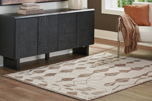 Haines Furniture Outlet - Ashley Furniture - Brettler Rug - 5' x 7' Rug / Beige/Brown - R406792