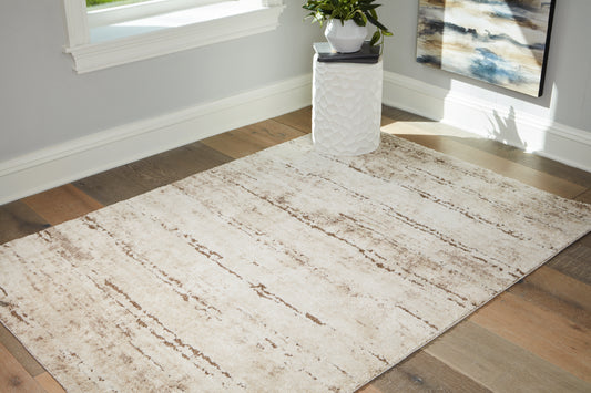 Haines Furniture Outlet - Ashley Furniture - Kasney Rug - 8' x 10' Rug / Cream/Brown - R406851