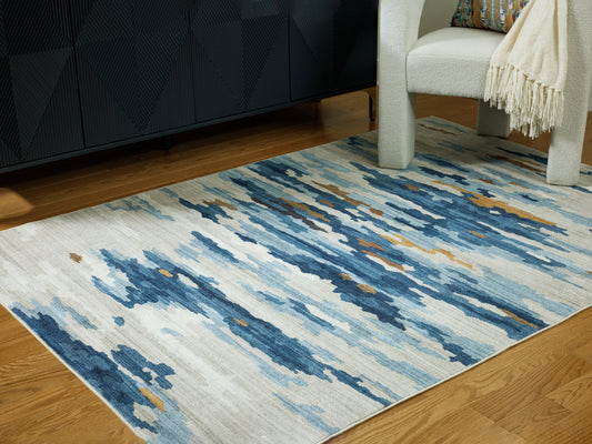 Haines Furniture Outlet - Ashley Furniture - Vinlett Rug - 5' x 7' Washable Rug / Cream/Blue/Brown - R407042