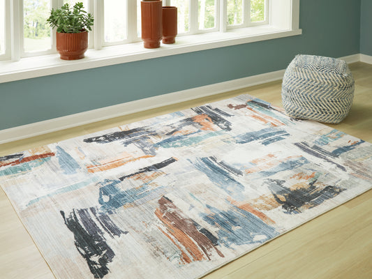 Haines Furniture Outlet - Ashley Furniture - Hessland Rug - 8' x 10' Washable Rug / Multi - R407051