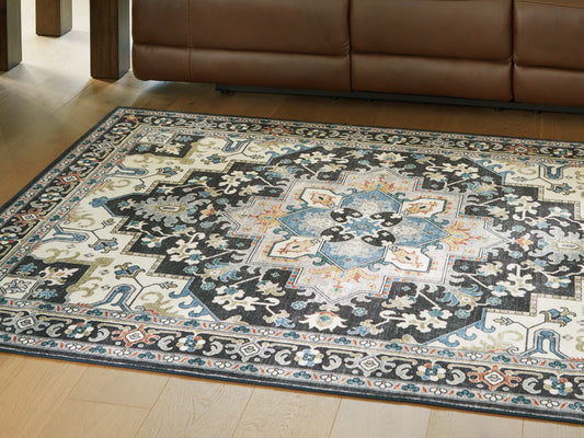 Haines Furniture Outlet - Ashley Furniture - Leningston Rug - 5' x 7' Washable Rug / Black/Cream/Blue - R407062
