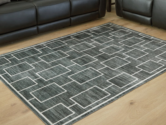 Haines Furniture Outlet - Ashley Furniture - Elderland Rug - Washable 5' x 7' Area Rug / Black/Gray - R407402