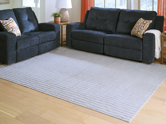 Haines Furniture Outlet - Ashley Furniture - Worthley Rug - Washable 5' x 7' Area Rug / Gray - R407452