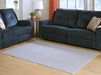Haines Furniture Outlet - Ashley Furniture - Worthley Rug - Washable 5' x 7' Area Rug / Gray - R407452