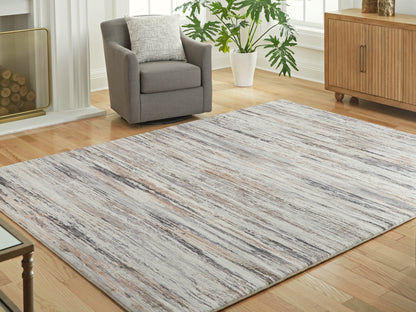 Haines Furniture Outlet - Ashley Furniture - Nace Rug - 7'6" x 9'6" Area Rug / Gray/Brown/White - R407471