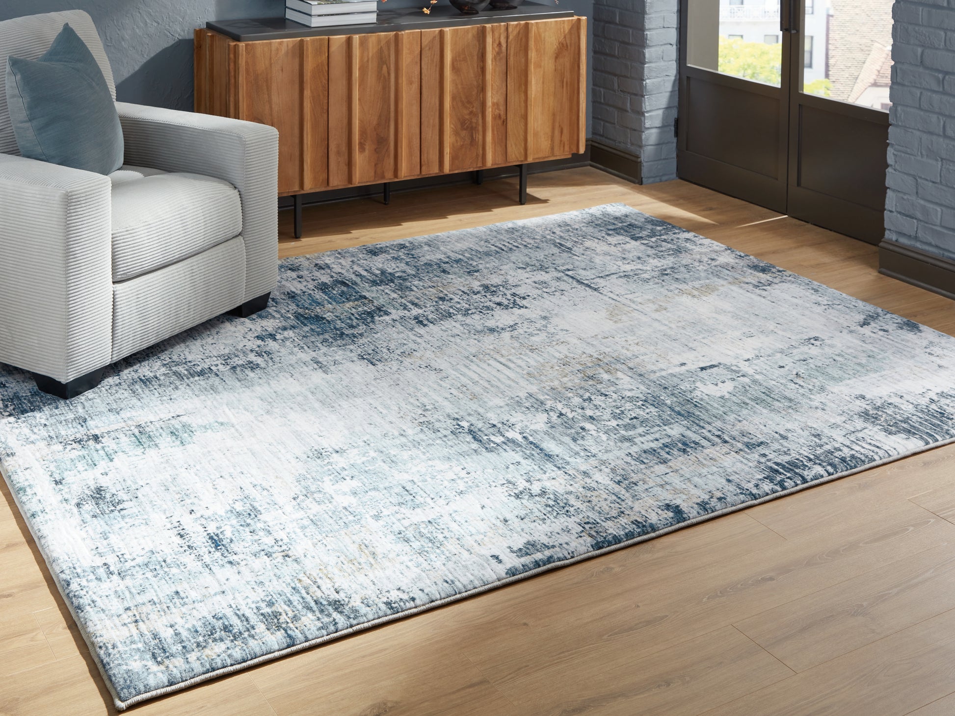 Haines Furniture Outlet - Ashley Furniture - Arlenmont Rug - 7'6" x 9'6" Area Rug / Blue/White/Brown - R407481