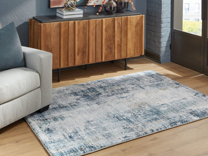 Haines Furniture Outlet - Ashley Furniture - Arlenmont Rug - 5' x 7' Area Rug / Blue/White/Brown - R407482