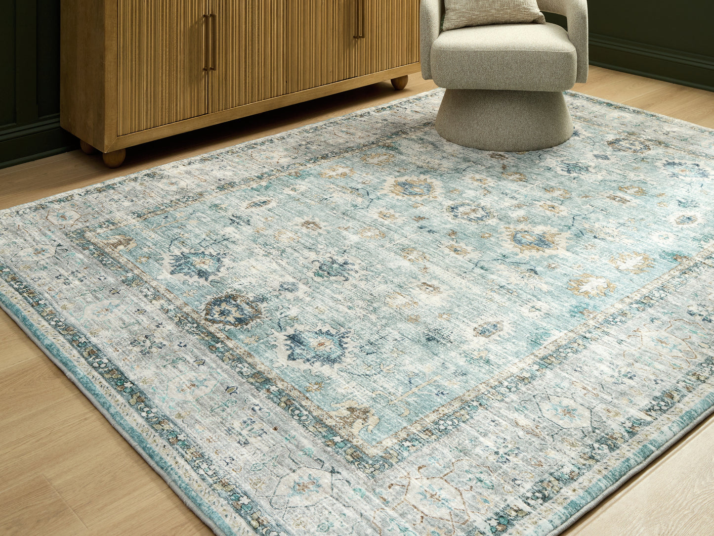 Haines Furniture Outlet - Ashley Furniture - Ladstoney Rug - 7'6" x 9'6" Area Rug / Teal/Beige/Ochre - R407501