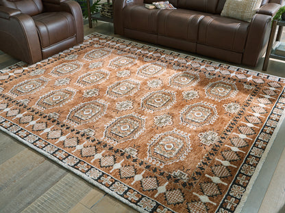 Haines Furniture Outlet - Ashley Furniture - Qaabiz Rug - 7'8" x 10' Area Rug / Sienna/Ivory/Black - R407521