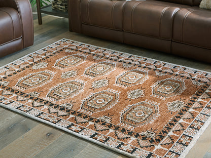 Haines Furniture Outlet - Ashley Furniture - Qaabiz Rug - 5' x 7' Area Rug / Sienna/Ivory/Black - R407522
