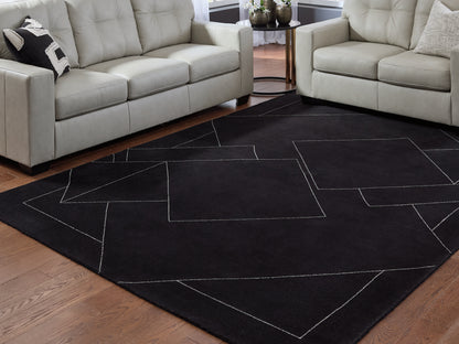 Haines Furniture Outlet - Ashley Furniture - Marav Rug - 7'8" x 10' Area Rug / Black/White - R407531