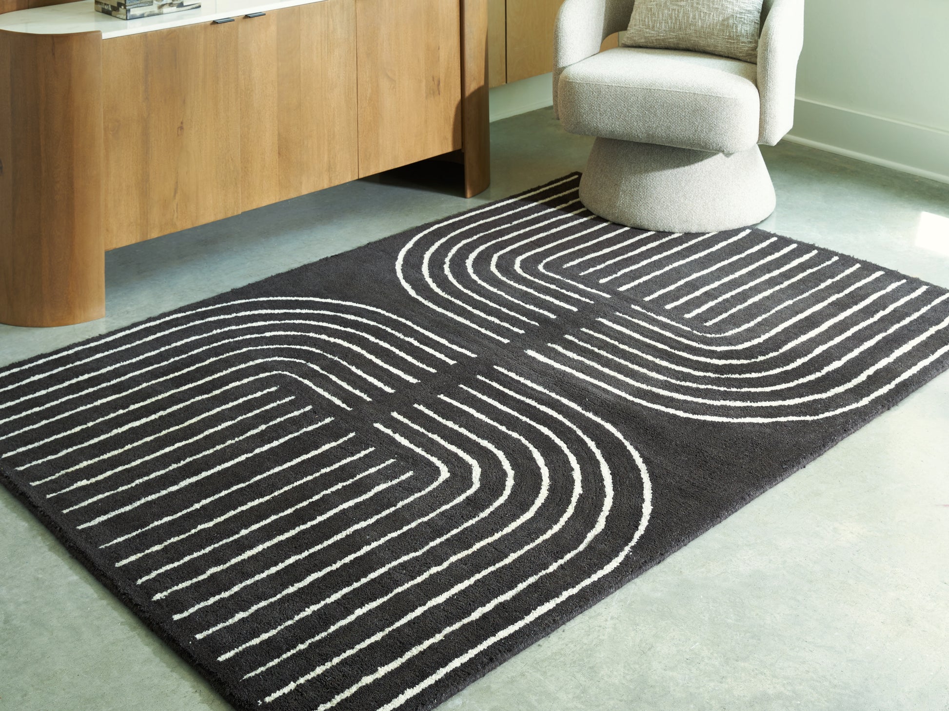 Haines Furniture Outlet - Ashley Furniture - Eldonmore Rug - 5' x 7' Area Rug / Black/Ivory - R407572