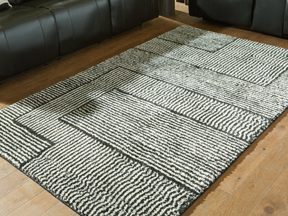 Haines Furniture Outlet - Ashley Furniture - Kurtmen Rug - 5' x 7' Area Rug / Black/Ivory - R407592
