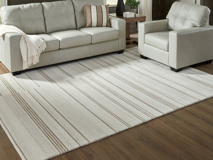 Haines Furniture Outlet - Ashley Furniture - Gadence Rug - 5' x 7' Area Rug / Ivory/Tan - R407642