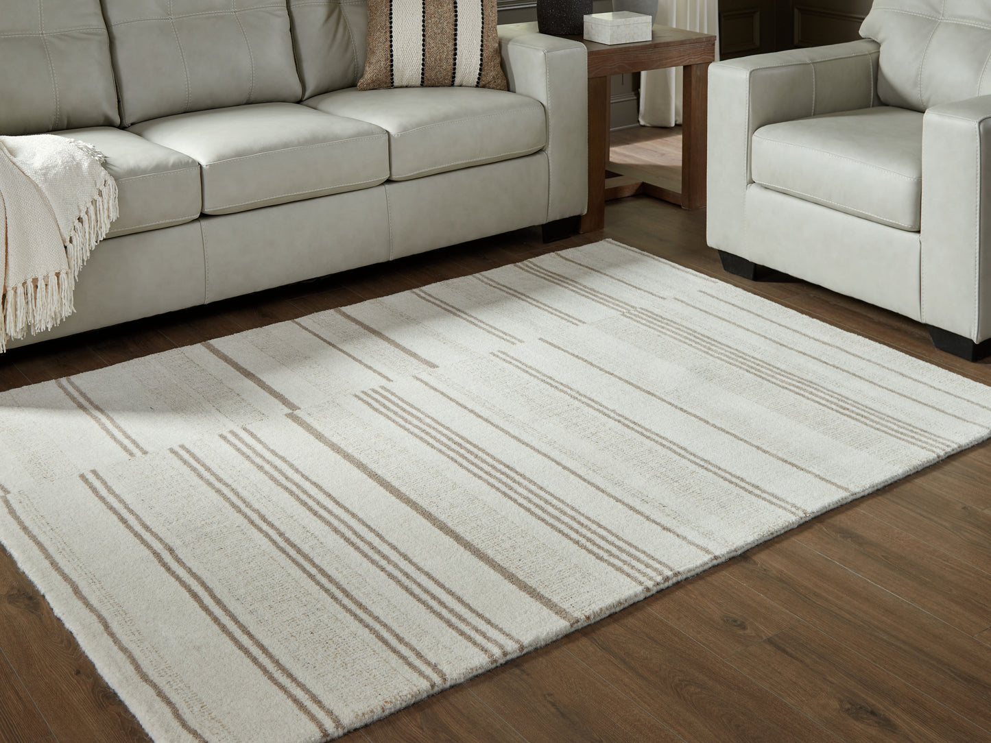 Haines Furniture Outlet - Ashley Furniture - Gadence Rug - 5' x 7' Area Rug / Ivory/Tan - R407642