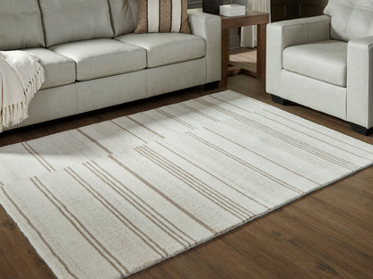 Haines Furniture Outlet - Ashley Furniture - Gadence Rug - 5' x 7' Area Rug / Ivory/Tan - R407642