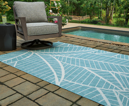 Haines Furniture Outlet - Ashley Furniture - Hulsia Rug - 5' x 7' Rug / Ivory/Aqua - R900122